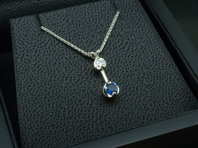 9kt White Gold Diamond and Sapphire Drop Pendant, Claw Set Design, Round Brilliant Cut Diamond, Round Blue Sapphire