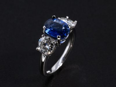 Ladies Diamond and Sapphire Trilogy Engagement Ring, Platinum Claw Set Design, Oval Cut Blue Sapphire 1.35ct, Round Brilliant Cut Diamonds 0.88ct Total (2)