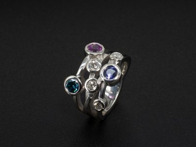Ladies Multi Stone Satellite Dress Ring, Platinum Rub over Set Design, Round Brilliant Cut Diamonds 0.54ct Total (4), Round Cut Blue Sapphire 0.57ct, Pink Sapphire 0.64ct, Purple Sapphire 0.55ct  