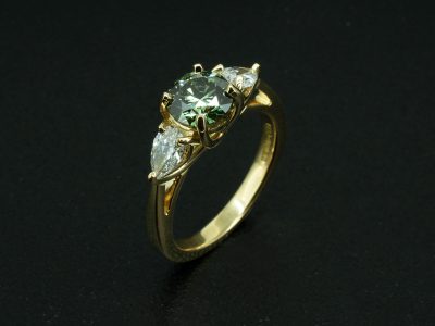 Ladies Yellow Gold Green Diamond Trilogy Engagement Ring, 18kt Yellow Gold Claw Set Design with Lattice Setting, Round Brilliant Cut Fancy Green Lab Grown Diamond 1.00ct, Pear Cut Diamonds 0.50ct Total (2)