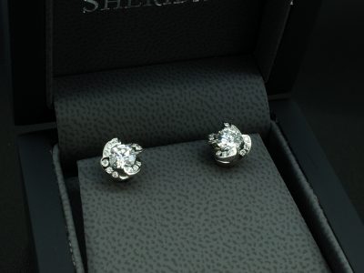 Platinum Diamond Floral Design Studded Earrings, Round Brilliant Cut Diamonds 1.00ct Total (2), 0.30ct Total (24), Twisted Floral Design