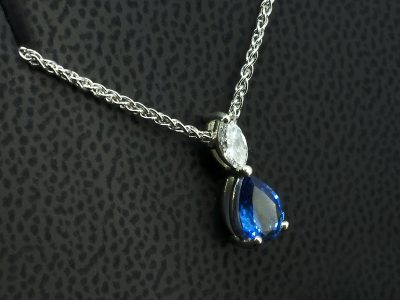 9kt White Gold Diamond and Sapphire Drop Pendant, Claw Set Design on 9kt White Gold Spiga Chain, Marquise Cut Diamond 0.10ct, Pear Cut Blue Sapphire 0.79ct